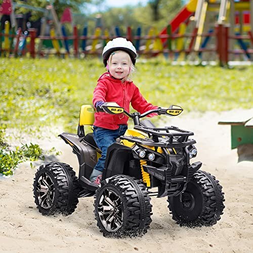 Kind op speelgoed-ATV in de speeltuin